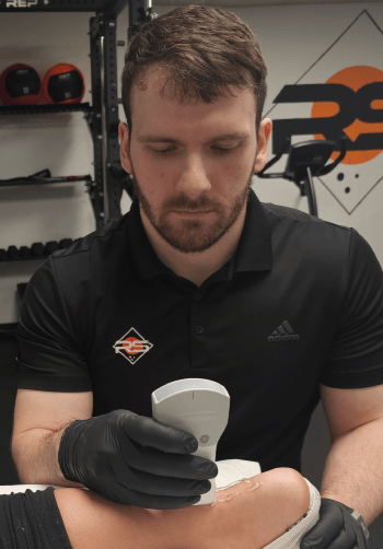 Ultrasound application at the ankle at Rock Solid Physical Therapy